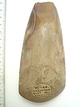 Neolithic flint hand axe, discovered Hampton 1897 65712001 Polished flint axe, with damage to butt Hampton 1897.jpg