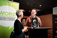 Alan Carter receiving the Ngaio Marsh Award at WORD Christchurch Festival, September 2018 AlanCarterNgaioMarshAward2018.jpg