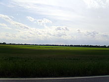 The flat terrain and rich soils of the Arkansas Delta near Arkansas City are in stark contrast to the northwestern part of the state. Arkansas Delta, Desha County, AR.jpg
