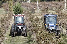 Driverless compact tractors perform fully autonomous spraying tasks at a Texas vineyard. Autonomous compact tractors in a Texas vineyard, Nov 2012.jpg