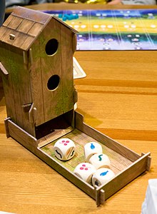 Birdfeeder dice tower, a component for Wingspan. Birdfeeder dice tower in Wingspan board game.jpg