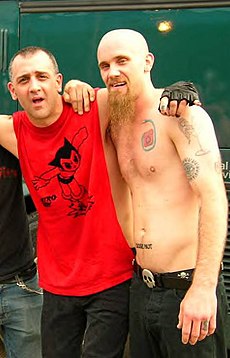 Cafaro (left) with Nick Oliveri in 2006.