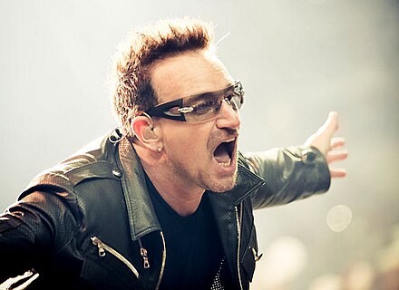 Bono performing with U2 in 2011