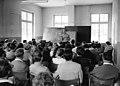 Karlheinz Stockhausen lecturing at Darmstadt, July 1957. Photo by Rolf Unterberg (Deutsches Bundesarchiv).