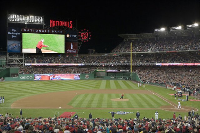 President George W. Bush throws the ceremonial first pitch before a sold-out crowd at the Washington Nationals season opener on March 30 at their new 