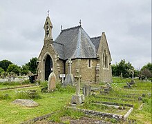 The second chapel is used by the grounds maintenance workers for storage Cemetery chapel Louth Cemetery.jpg