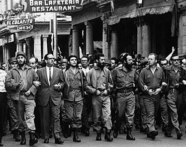 Fidel Castro (far left), Che Guevara (centre), and William Alexander Morgan (second from the right) lead a memorial march in Havana on 5 March 1960 for the victims of La Coubre freight ship explosion CheLaCoubreMarch.jpg