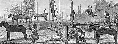 Children's outdoor gymnasium, circa 19th Century. The equipment, which was standard for the time, includes ladders, gymnastic horses, and parallel bars. Children's outdoor gymnasium circa 19th Century.jpg