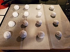 Placing cookies on baking sheet