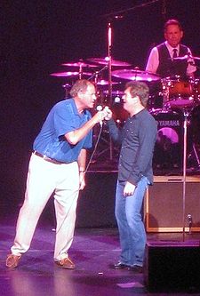 Berman sings "Walking on a Thin Line" with Huey Lewis and the News on stage Chris Berman sings with Huey Lewis (edit).jpg