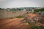 Thumbnail for File:City building over fence 3.jpg