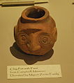 மண்பானையில் மனித முகம் (A clay pot with a face)