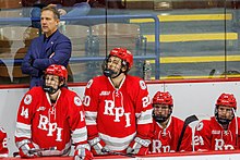 Coach David Smith with players John Evans, Henri Schreifels, James McIsaac, and Jack Brackett. Coach David Smith and RPI Engineers players.jpg