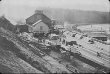 Sawmill of the Connecticut River Lumber Company on the shores of the cove, c. 1890 Connecticut River Lumber Company mills on Log Pond Cove, c. 1890.png