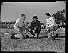 Captain Dan Hill, coach Wallace Wade, and captain Eric Tipton practicing in a Pasadena park ahead of the Rose Bowl Dan Hill and Eric Tipton of the Duke Blue Devils with Coach Wallace Wade, Pasadena, 1938.jpg
