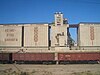 A grain elevator and train north of Shu, Kazakhstan, in 2007 on the Turkestan–Siberia Railway
