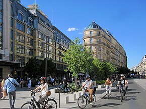 People walking and cycling in Paris, France. The concept of 15-minute cities gained traction after being advocated by Paris mayor Anne Hidalgo. Exterior of La Samaritaine 2.jpg