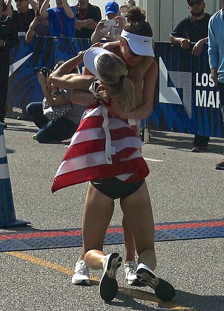 Shalane Flanagan collapses into Amy Cragg's arms while celebrating after the 2016 U.S. Olympic Trials Marathon