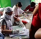 Frontline workers filling out COVID19 vaccination cards in Bihar.jpg