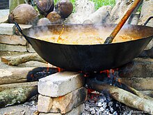 Cooking gulai in a kawah, a large vessel akin to a wok. Gulai-Indonesian curry-01.jpg