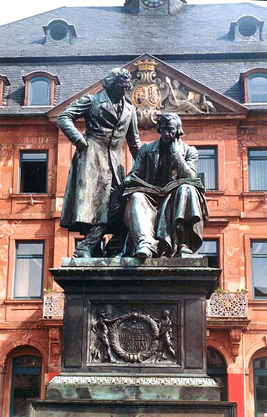 Monument to brothers Grimm in the market place in Hanau. (Hessen, Germany)