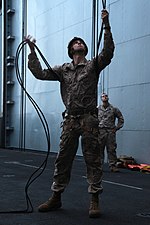 Thumbnail for File:Helicopter Rope Suspension Technique Masters, Maritime Raid Force practice rappelling techniques 130305-M-YG378-118.jpg
