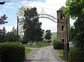 The Confederate Memorial (pictured center right) is located atop a small mound in Indian Mound Cemetery just inside the cemetery's entrance. Indian Mound Cemetery Romney WV 2010 04 25 04.JPG