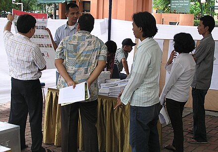 Polling stations conducted manual counts of ballots cast. IndonesianVoteCounting.jpg
