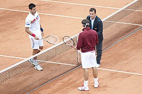 Djokovic and Federer moments before the 2011 French Open semifinal where Federer won in four sets to give Djokovic his first loss of the season. Novak Djokovic and Roger Federer at RG 2011.jpg