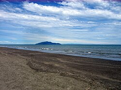 Phot of Otaki Beach with Kapiti Island in the distance