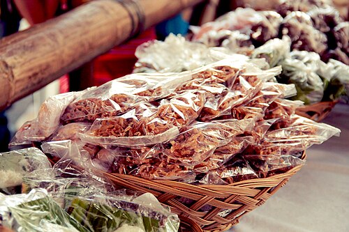 Packaged bukayo (sweetened coconut strips) at a market (watermark removed).jpg