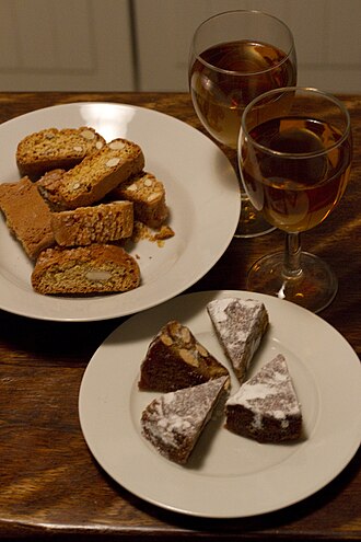 Besgano bianco was historically used as a blending grape in the production of Vin Santo. Panforte, biscotti, and Vin Santo.jpg