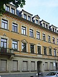 Apartment building with shop in closed development