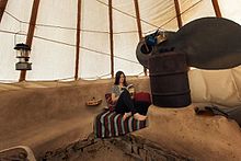 A rocket mass heater inside a tipi at Paul Wheaton's permaculture homestead in Montana Rocket Mass Heater Inside a Tipi.jpg