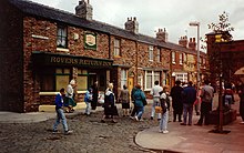 The Coronation Street set, pictured in 2005. Lancashire appeared in the serial for five years between 1991 and 1996 Rovers Return tour.jpg