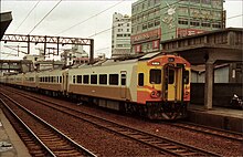 An EMU200 series train in Banqiao Station in 1989. Taiwan Railway Administration EMU 206 Banqiao 1989.jpg