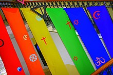 Symbols of the world's largest religions displayed on rainbow flags at the Queer Easter, Germany The symbols of the different big world religions on a rainbow - flag at Queer Easter.jpg