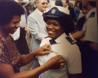 Theresa Claiborne having her Wings pinned on by her mother Theresa Claiborne Wings.png