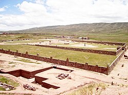 Tiahuanaco ruins with the village of Tiawanaku in the background