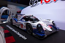 Blue-and-white race car on display