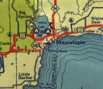 The Manistique area in mid-1936; US 2, denoted by a thick red line, runs east–west through the area north of its current routing, which is shown as a 