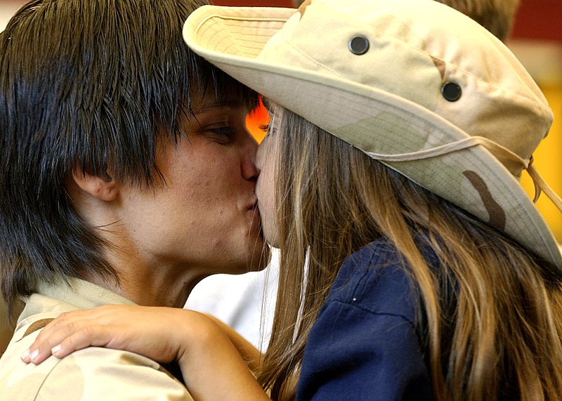 File:US Navy 040727-N-5576W-003 Store Keeper 2nd Class Angela Corrigan, kisses her daughter before deployment.jpg