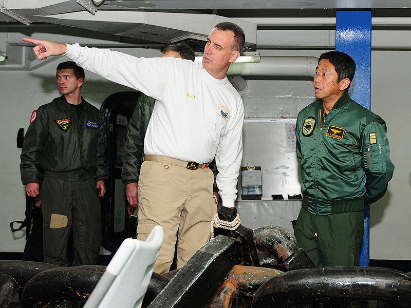 File:US Navy 101206-N-5538K-082 Capt. Daniel C. Grieco, left, executive officer of the aircraft carrier USS George Washington (CVN 76) shows the ship's.jpg