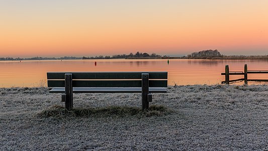 Sun rises over a wintry landscape. Location, Langweerderwielen (Langwarder Wielen) and surroundings.