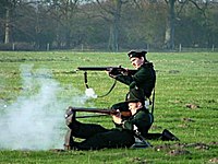 95th Rifles reenactors. 2 95th riflemen in various fighting stances.JPG