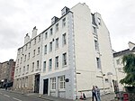 53-63 (Odd Nos) Canongate, Whitefoord House And Callander House (Scottish Veteran's Residence) Including Hall, Lodges At 142 And 144 Calton Road, Tenements At 57, 59 & 61 Canongate, Boundary Walls, Gatepiers And Gates