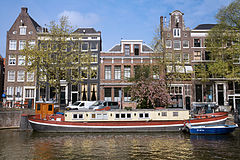 Street scene. Boathouse in an Amsterdam Channel. The Netherlands