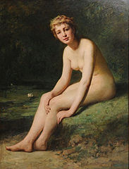 Desnudo femenino junto a un estanque con nenúfares