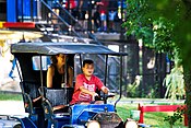 Boy driving vehicle at KidZville Station - Canada's Wonderland.jpg