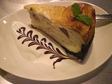 Cheesecake served with a cream and chocolate sauce dessert sauce CHEESE CAKE.JPG